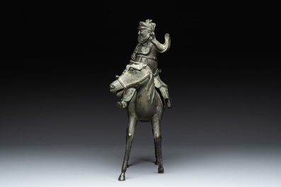A Vietnamese bronze brush washer on stand and a Chinese bronze warrior on horseback, 19th C.