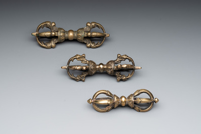 Three Tibetan bronze vajra and a copper incense burner, 18/20th C.