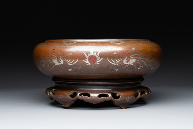 A Vietnamese bronze brush washer on stand and a Chinese bronze warrior on horseback, 19th C.