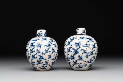 A pair of Chinese blue and white soft paste '100 boys' covered jarlets and a seal paste box, Kangxi mark, 19th C.