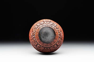 A Chinese cinnabar lacquer quadrifoil covered box and a 'lotus and shou' bowl, 19th C.