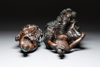 A large Chinese bronze Guanyin seated on rocks and a group of Guanyin with child, 20th C.
