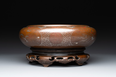 A Vietnamese bronze brush washer on stand and a Chinese bronze warrior on horseback, 19th C.