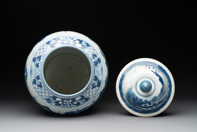 A near pair of Chinese blue and white 'landscape' vases and covers, 19th C.