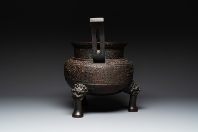 A large Chinese bronze archaistic 'taotie' tripod censer, 18th C.