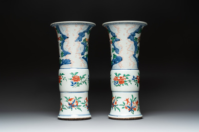 A pair of Chinese wucai 'gu' vases with narrative design, Transitional period