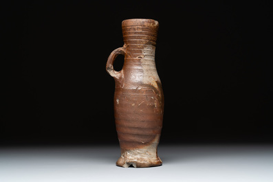 Eight stoneware jugs and mugs, and a glazed pottery vessel, Germany and The Netherlands, 16/17th C.
