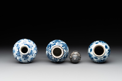 Two Chinese blue and white ewers and three vases, one silver mounted, Kangxi