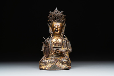 A Chinese parcel-gilt bronze Guanyin, Ming