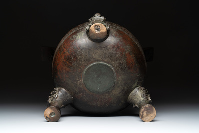 A large Chinese bronze archaistic 'taotie' tripod censer, 18th C.