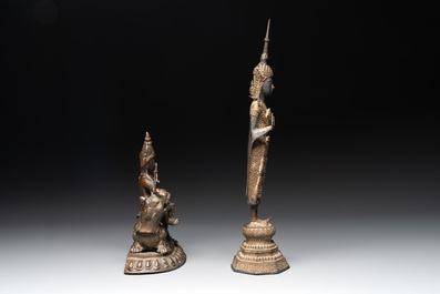 A bronze Simhanada Lokeshvara seated on a Buddhist lion and a Buddha, Southeast Asia, 19th C.