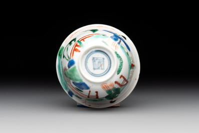 A Chinese famille verte ovoid tea caddy with floral design and a cup with figural design, Kangxi
