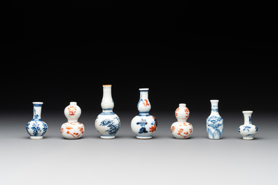 Seven Chinese iron-red, blue and white miniature vases, Kangxi