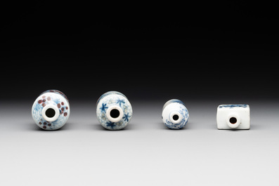 Four Chinese blue, white and copper-red snuff bottles with figural design, Yongzheng mark, 19th C.