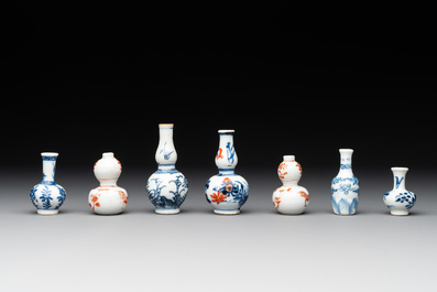 Seven Chinese iron-red, blue and white miniature vases, Kangxi