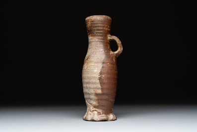 Eight stoneware jugs and mugs, and a glazed pottery vessel, Germany and The Netherlands, 16/17th C.