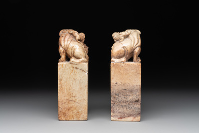 Two Chinese snuff bottles, four soapstone seals and a lacquer covered box, 20th C.