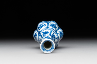 A Chinese blue and white facetted bottle vase with floral design, Kangxi