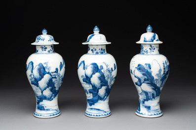 Three Chinese blue and white 'river landscape' vases and covers, Kangxi