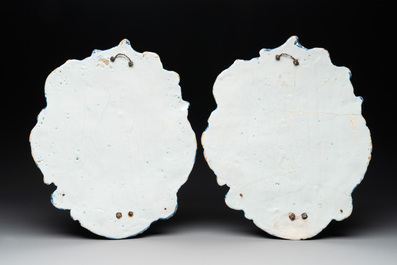 A pair of polychrome Dutch Delft plaques mounted as wall sconces with silver mounts, 18th C.
