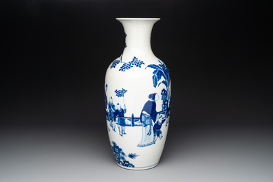 A Chinese blue and white vase with ladies and playing boys in a garden, 19th C.