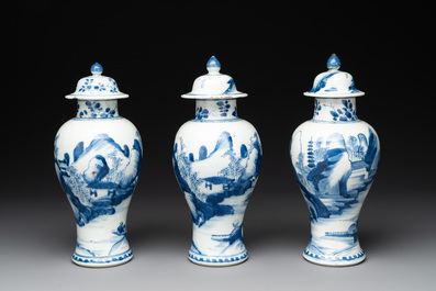 Three Chinese blue and white 'river landscape' vases and covers, Kangxi