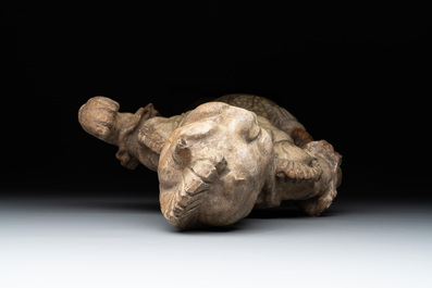 A Chinese stoneware cream-glazed sculpture of a warrior, possibly Tang