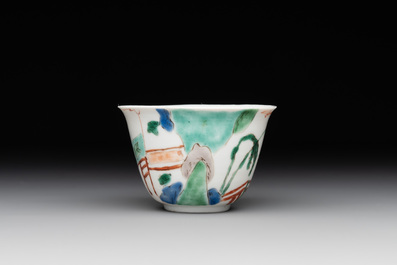 A Chinese famille verte ovoid tea caddy with floral design and a cup with figural design, Kangxi