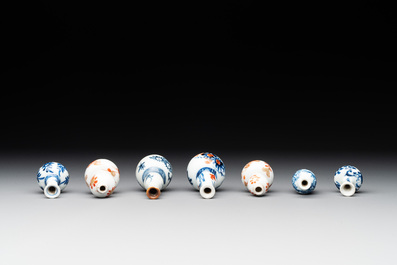 Seven Chinese iron-red, blue and white miniature vases, Kangxi