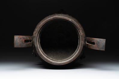 A large Chinese bronze archaistic 'taotie' tripod censer, 18th C.