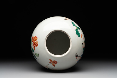 A Chinese famille rose 'ladies and boys' jar with wooden cover and stand, Yongzheng/Qianlong