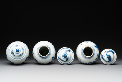 Three Chinese blue and white 'river landscape' vases and covers, Kangxi