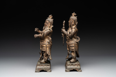 A pair of fine Chinese gilt bronze heavenly kings on stand, Ming