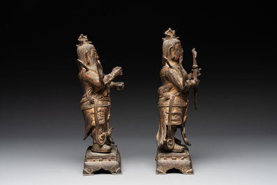 A pair of fine Chinese gilt bronze heavenly kings on stand, Ming