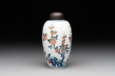 A Chinese famille verte ovoid tea caddy with floral design and a cup with figural design, Kangxi