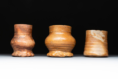 Eight stoneware jugs and mugs, and a glazed pottery vessel, Germany and The Netherlands, 16/17th C.