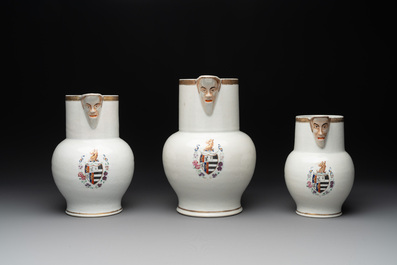 Three Chinese famille rose armorial 'face' ewers with the arms of Thomas Hankey, Qianlong