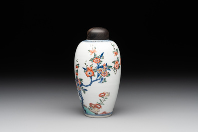 A Chinese famille verte ovoid tea caddy with floral design and a cup with figural design, Kangxi