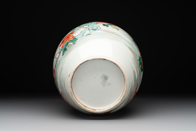 A Chinese famille rose 'ladies and boys' jar with wooden cover and stand, Yongzheng/Qianlong