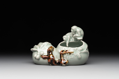 A Chinese celadon-glazed brush washer and a peanut nesting box, 20th C.