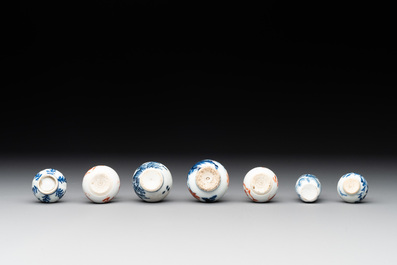 Seven Chinese iron-red, blue and white miniature vases, Kangxi