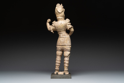 A Chinese stoneware cream-glazed sculpture of a warrior, possibly Tang