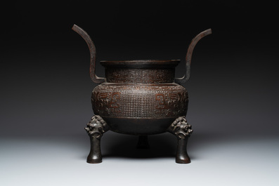 A large Chinese bronze archaistic 'taotie' tripod censer, 18th C.