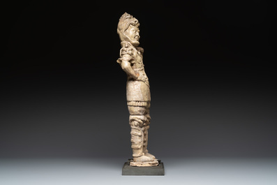 A Chinese stoneware cream-glazed sculpture of a warrior, possibly Tang