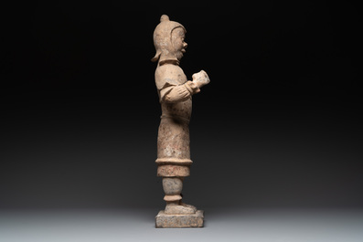 A large Chinese painted pottery figure of a standing guardian, Tang