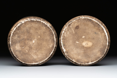 A pair of Chinese wucai 'gu' vases with narrative design, Transitional period