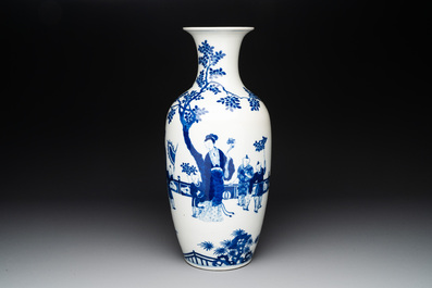 A Chinese blue and white vase with ladies and playing boys in a garden, 19th C.