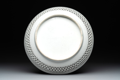 A Chinese famille rose 'mandarin subject' dish with a reticulated border, Qianlong