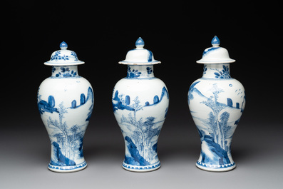 Three Chinese blue and white 'river landscape' vases and covers, Kangxi