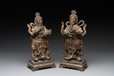 A pair of fine Chinese gilt bronze heavenly kings on stand, Ming